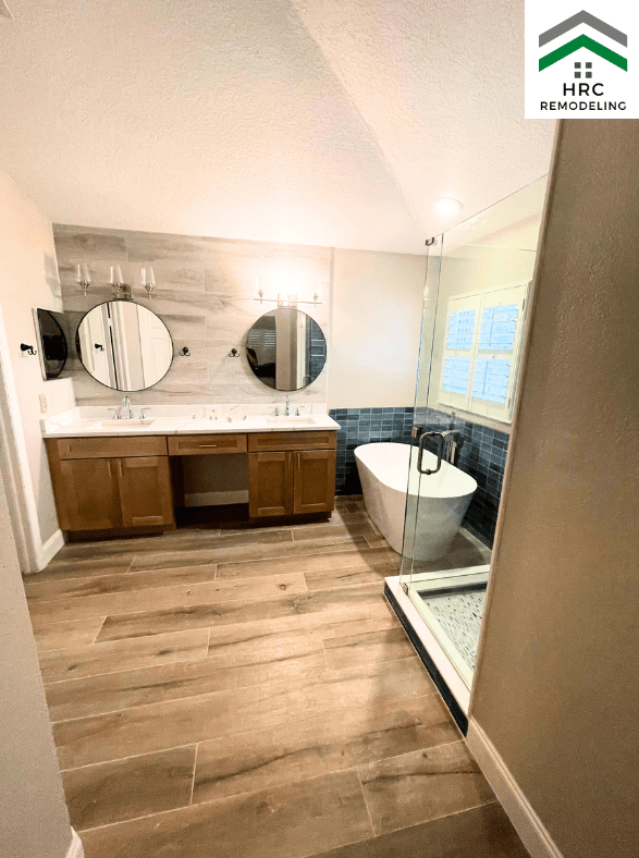 master bathroom remodel blue tile and custom vanity and freestanding tub