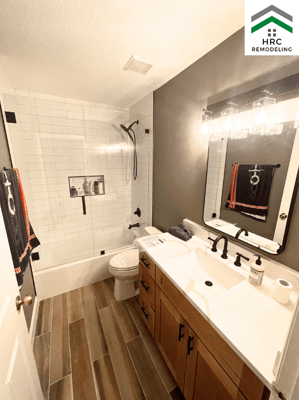 custom guest bathroom remodel with subway tile and shower door