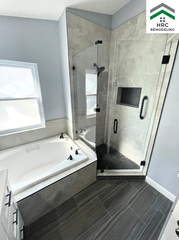 small master bathroom with shower and tub and custom glass door