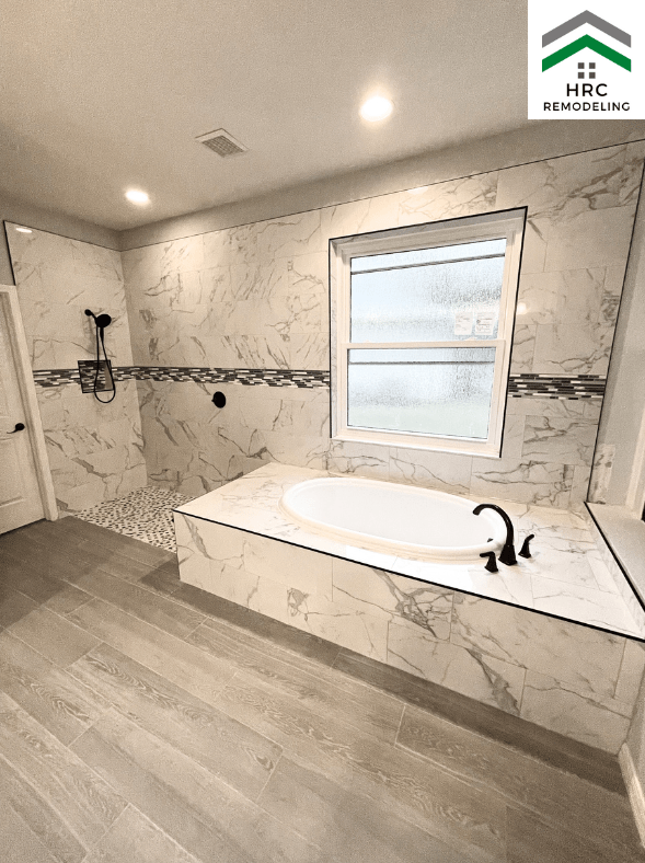 large bathroom with walk in shower and garden tub