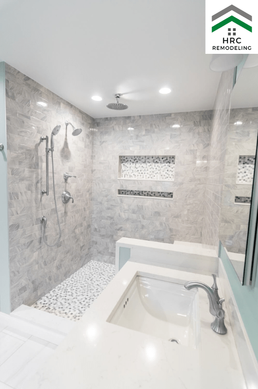 bathroom remodel with ceiling shower head and shampoo box