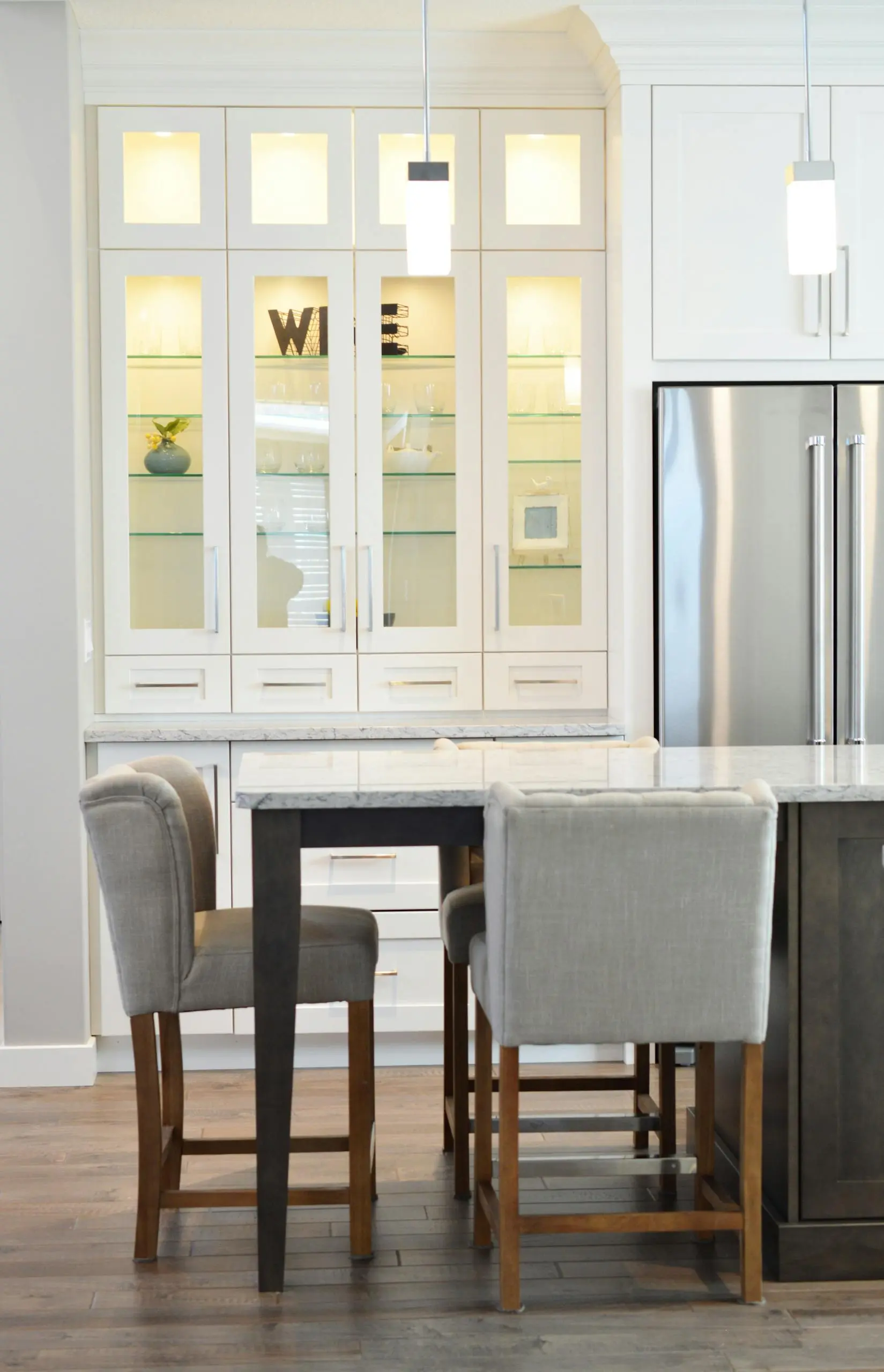 Clean and contemporary kitchen interior with white cabinets and minimalist decor.